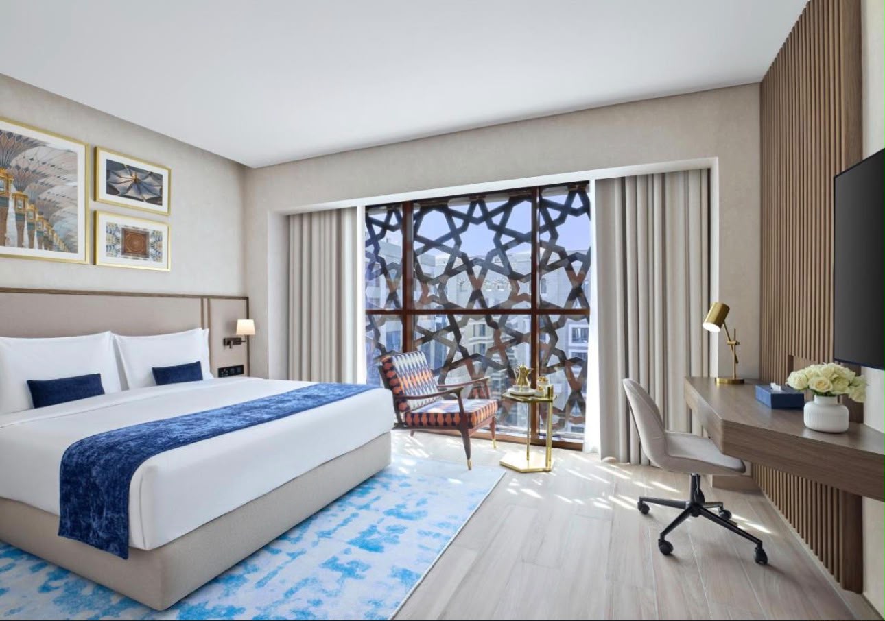 A guest room at Makarem Burj Al Madinah, with a mashrabiya screen over the window &mdash; photograph 1 of 35